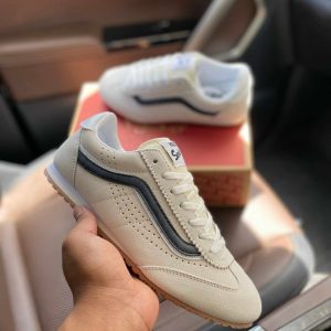 Vans Super Lowpro White Black First Copy Shoes held in hand with box in background