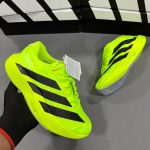 Premium quality Adidas Adizero Evo SL Green first copy shoes with neon green mesh and black stripes, available with cash on delivery from Martify