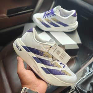 Adidas Adizero Evo SL DAWGS first copy shoes in white with purple and gold graphics, lightweight cushioned sole, available with cash on delivery from Martify.