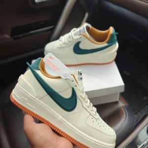 Nike Airforce Ambush Green first copy shoes in cream leather with green Swoosh and orange accents, available with cash on delivery from Martify.