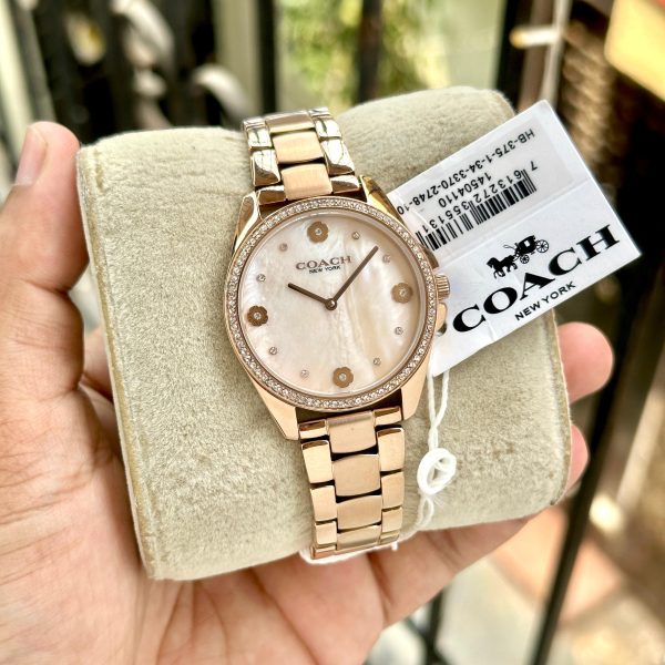 Coach women’s rose gold mother of pearl dial stainless steel watch with analogue display