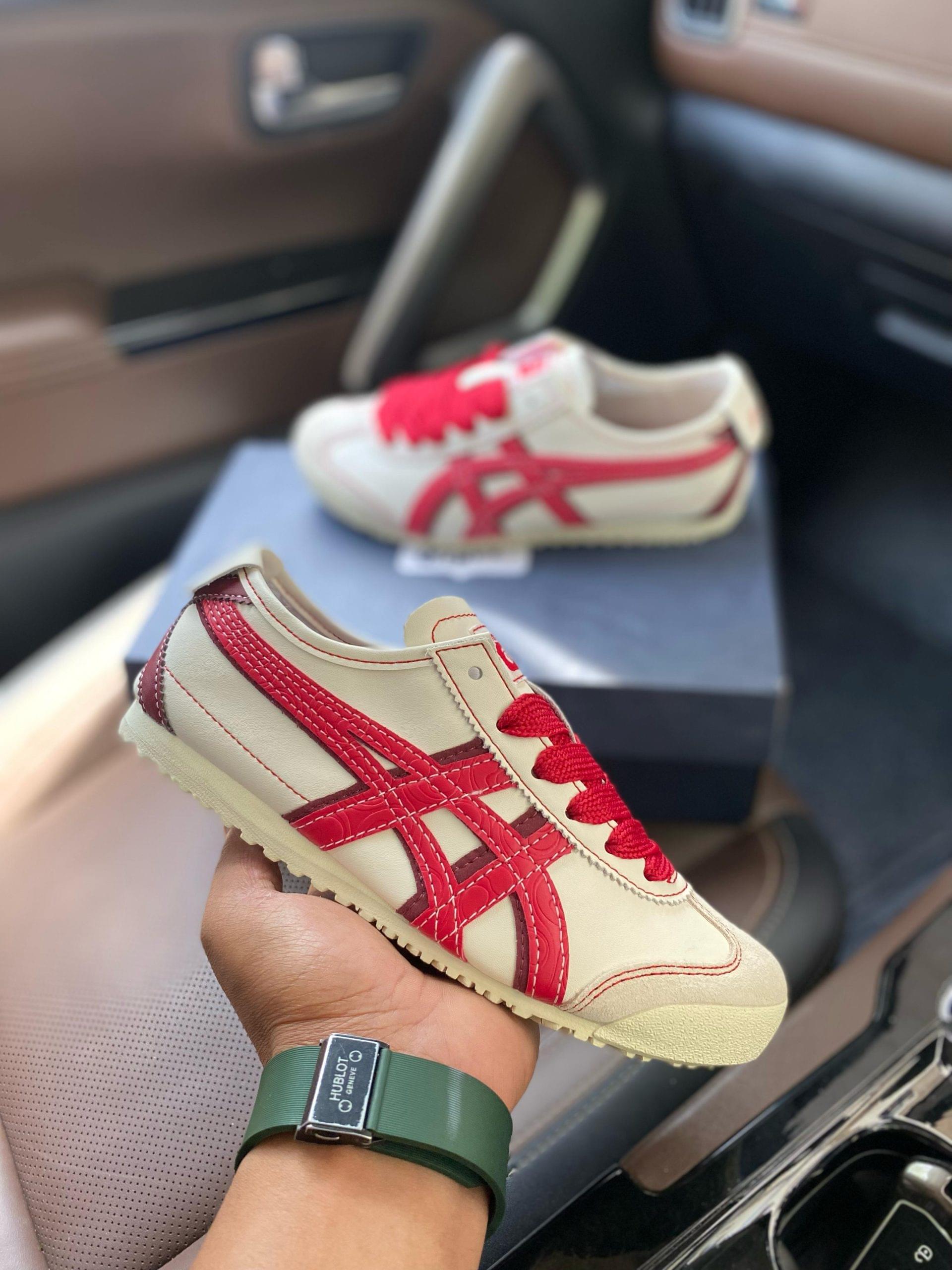 Onitsuka Tiger maxico 66 Cream Samba First Copy Shoes in cream with red detailing held in hand
