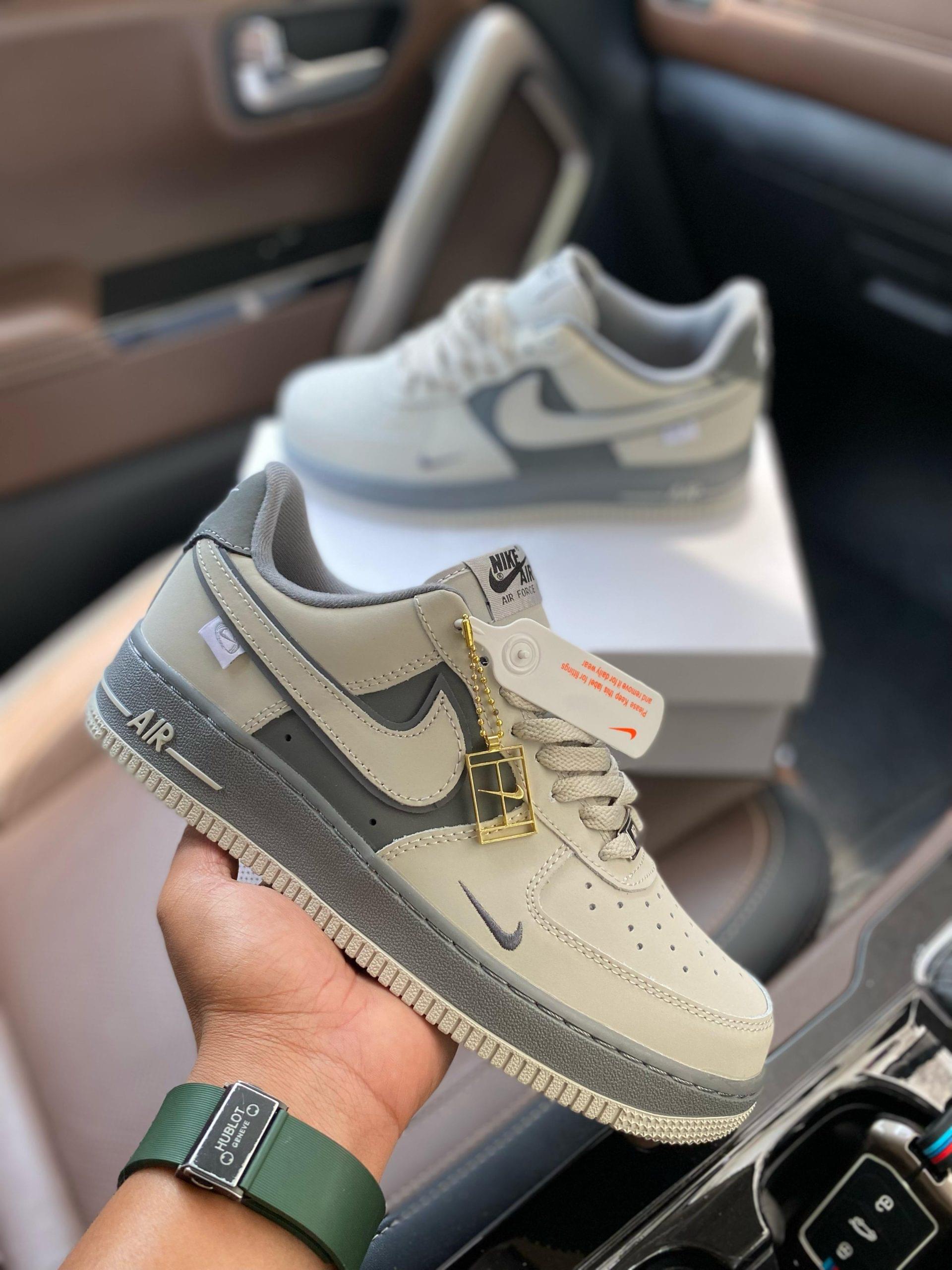 Airforce 1 Low Molten Metal first copy shoes with dual-tone grey finish held in hand over original box