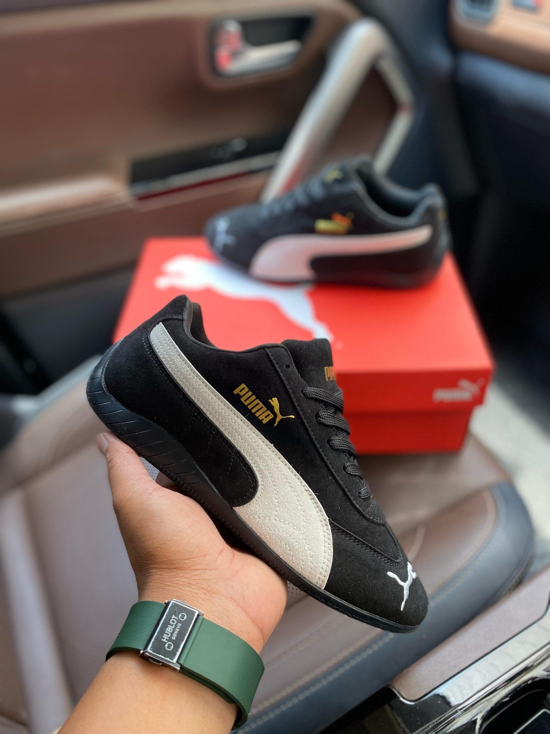 Puma Speedcat First Copy Shoes in Black White color held in hand with box